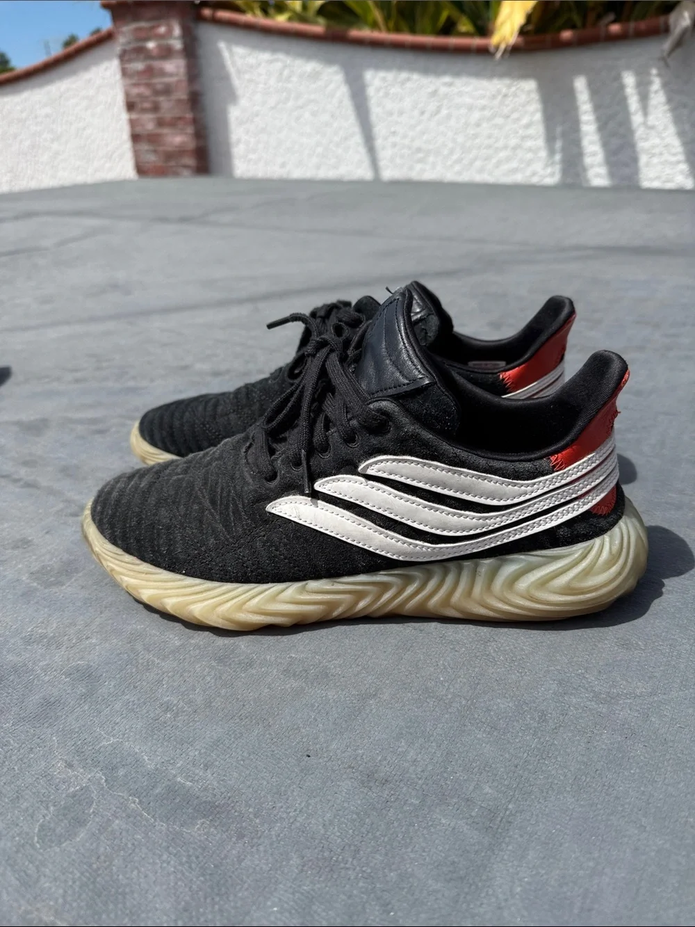 adidas Black Sneakers with White Stripes and Red Heel